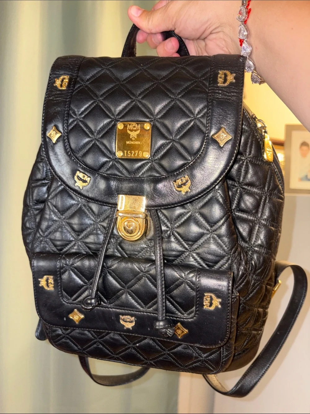 MCM Black Quilted Leather Backpack with Gold Accents